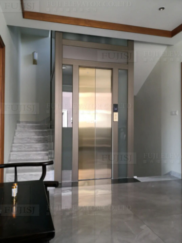 Gold framed glass elevator